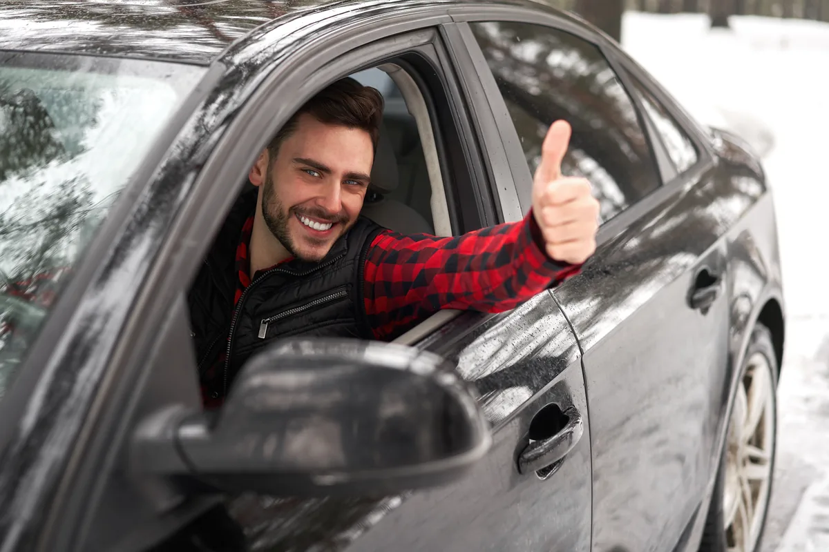 Happy member with a freshly washed car